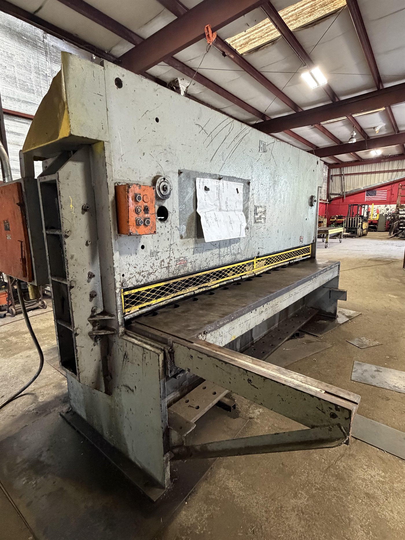 Industrial steel shear used for shearing, punching, and cutting services